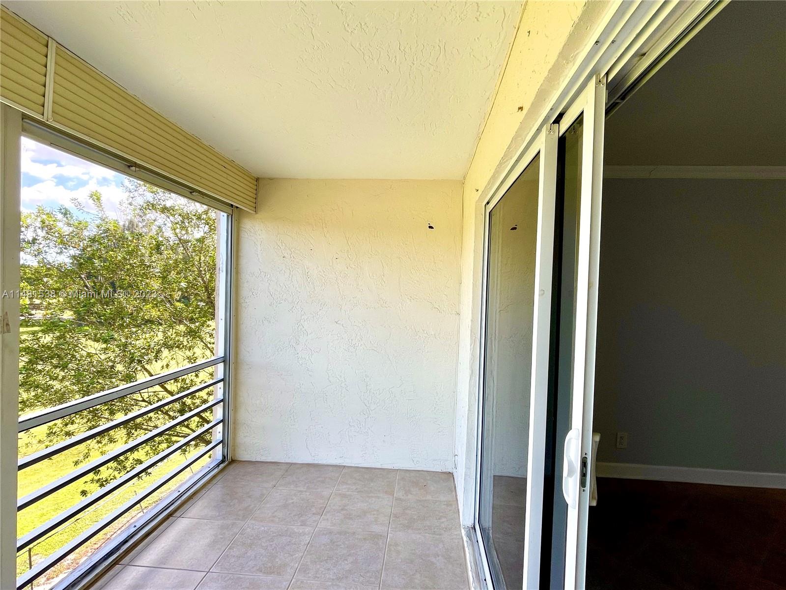 5100 Southwest 90th Avenue, Unit 303 Cooper City, FL 33328 - Photo 11 of 36 a view of front door