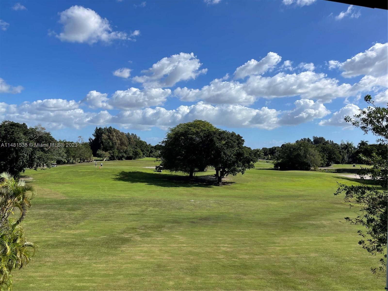 5100 Southwest 90th Avenue, Unit 303 Cooper City, FL 33328 - Photo 14 of 36 a view of a golf course with an ocean