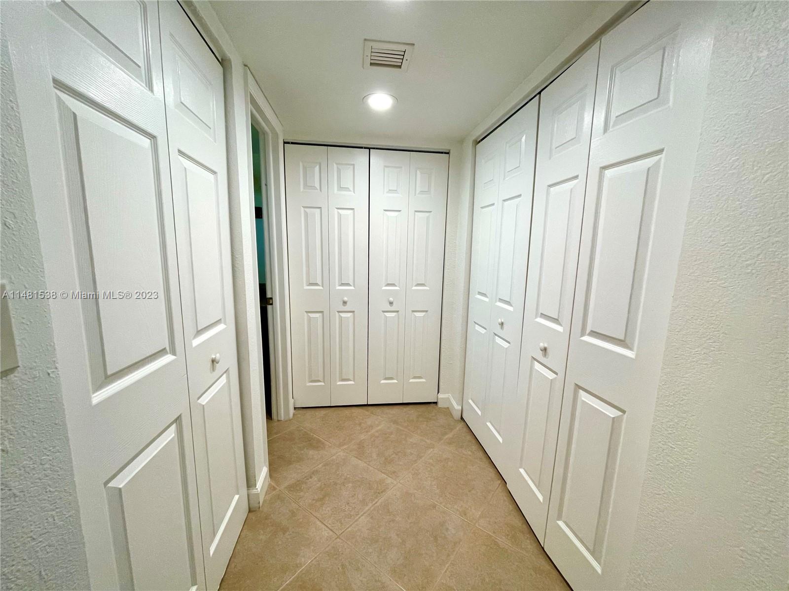 5100 Southwest 90th Avenue, Unit 303 Cooper City, FL 33328 - Photo 21 of 36 a view of a hallway