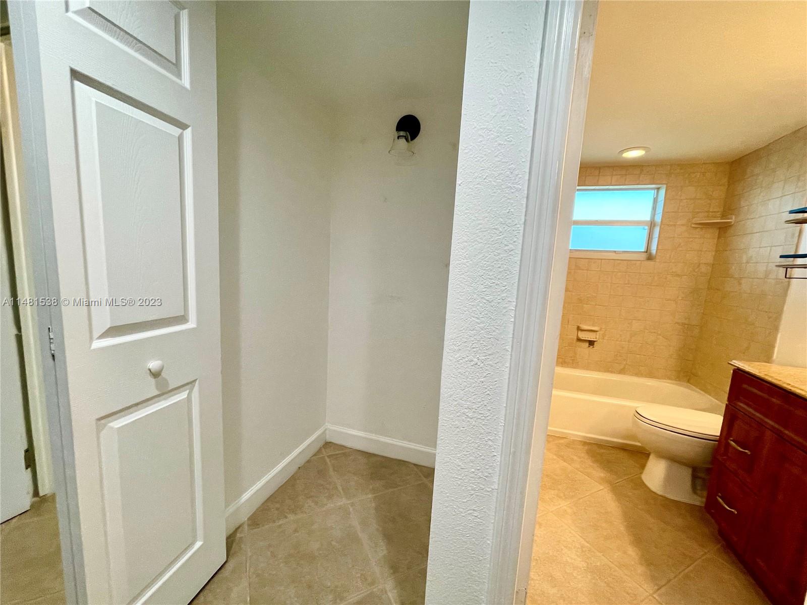 5100 Southwest 90th Avenue, Unit 303 Cooper City, FL 33328 - Photo 28 of 36 a bathroom with a tub and toilet