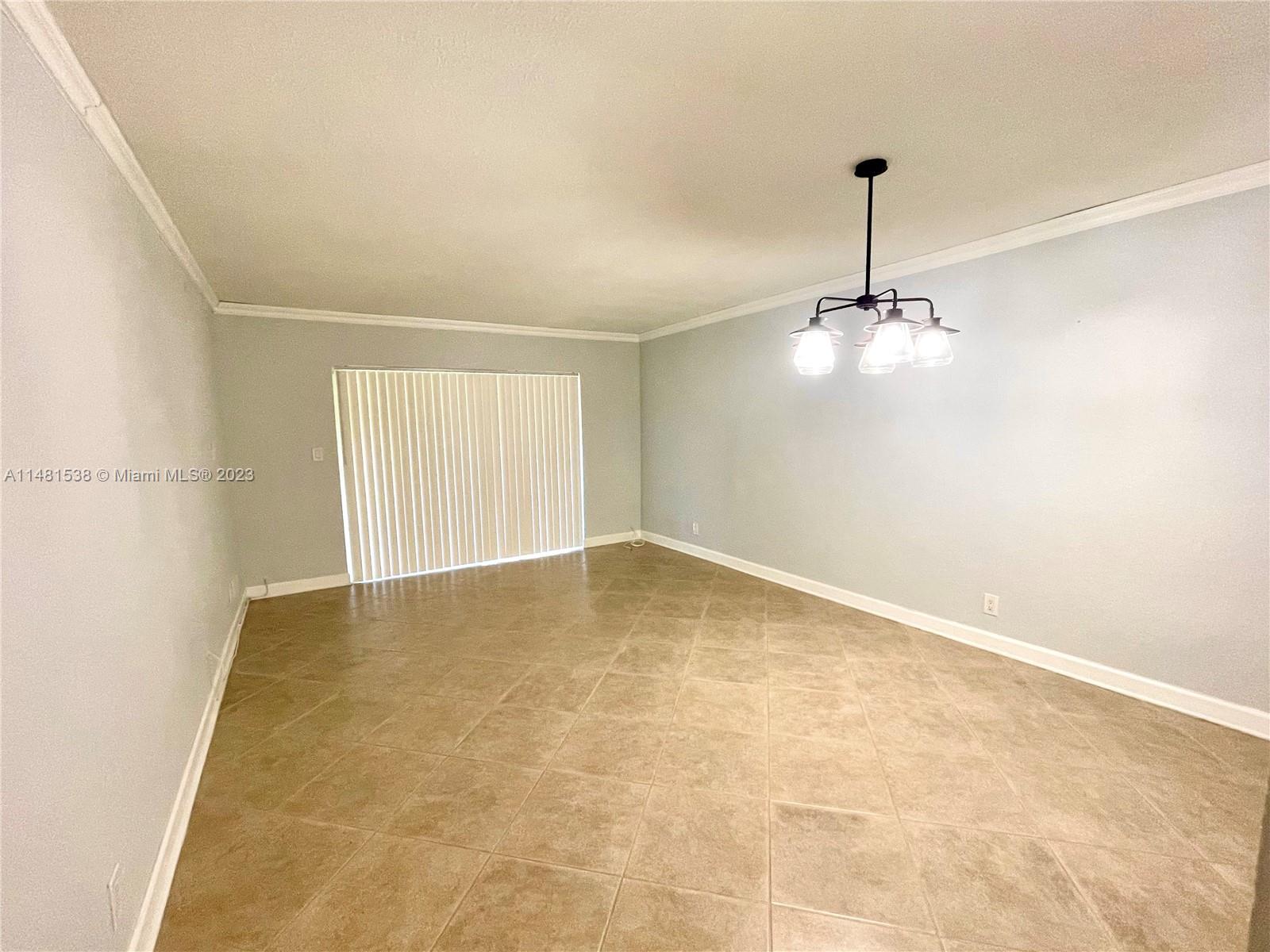 5100 Southwest 90th Avenue, Unit 303 Cooper City, FL 33328 - Photo 3 of 36 a view of empty room with windows