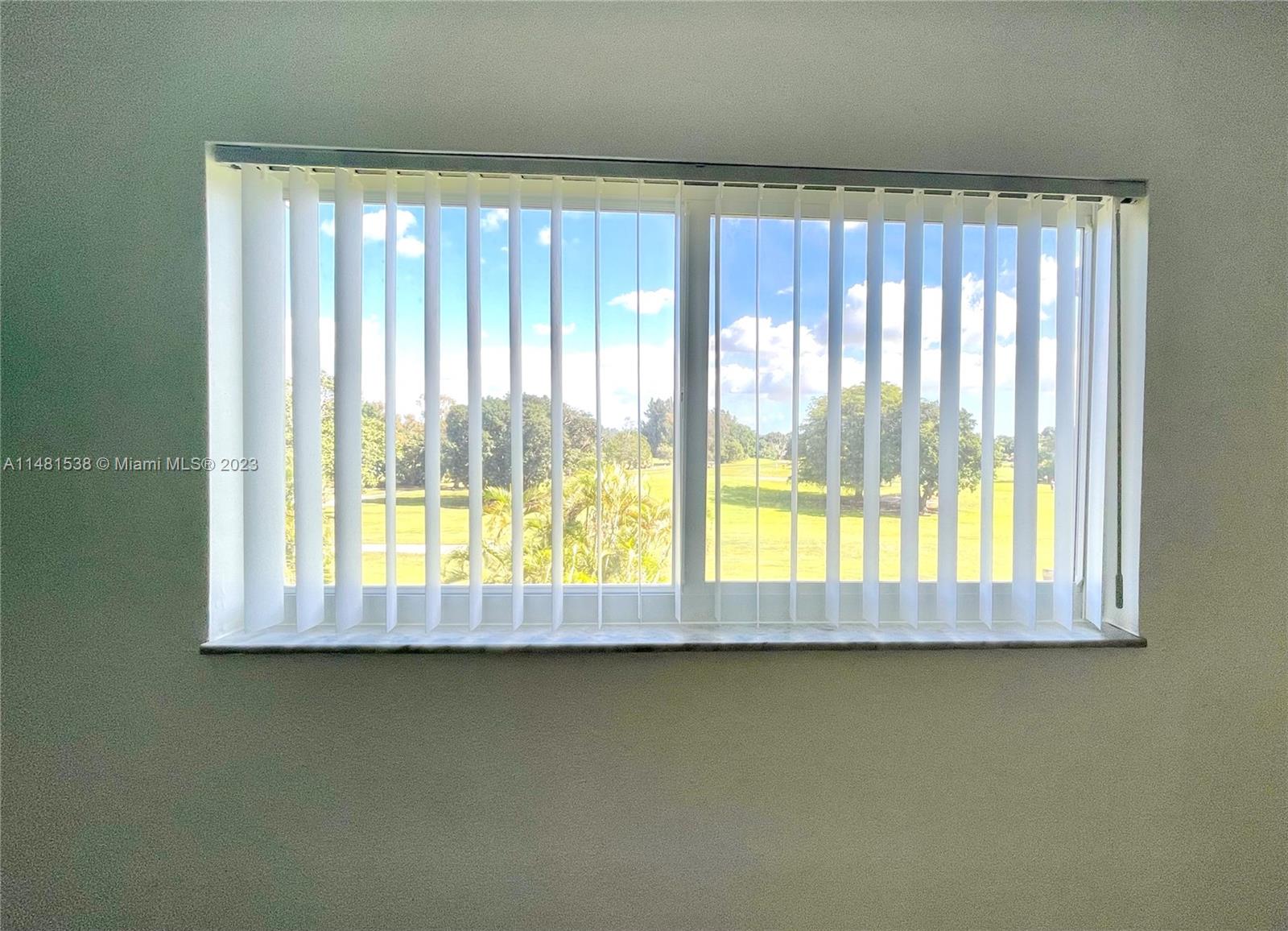 5100 Southwest 90th Avenue, Unit 303 Cooper City, FL 33328 - Photo 34 of 36 a view of an empty room with a window