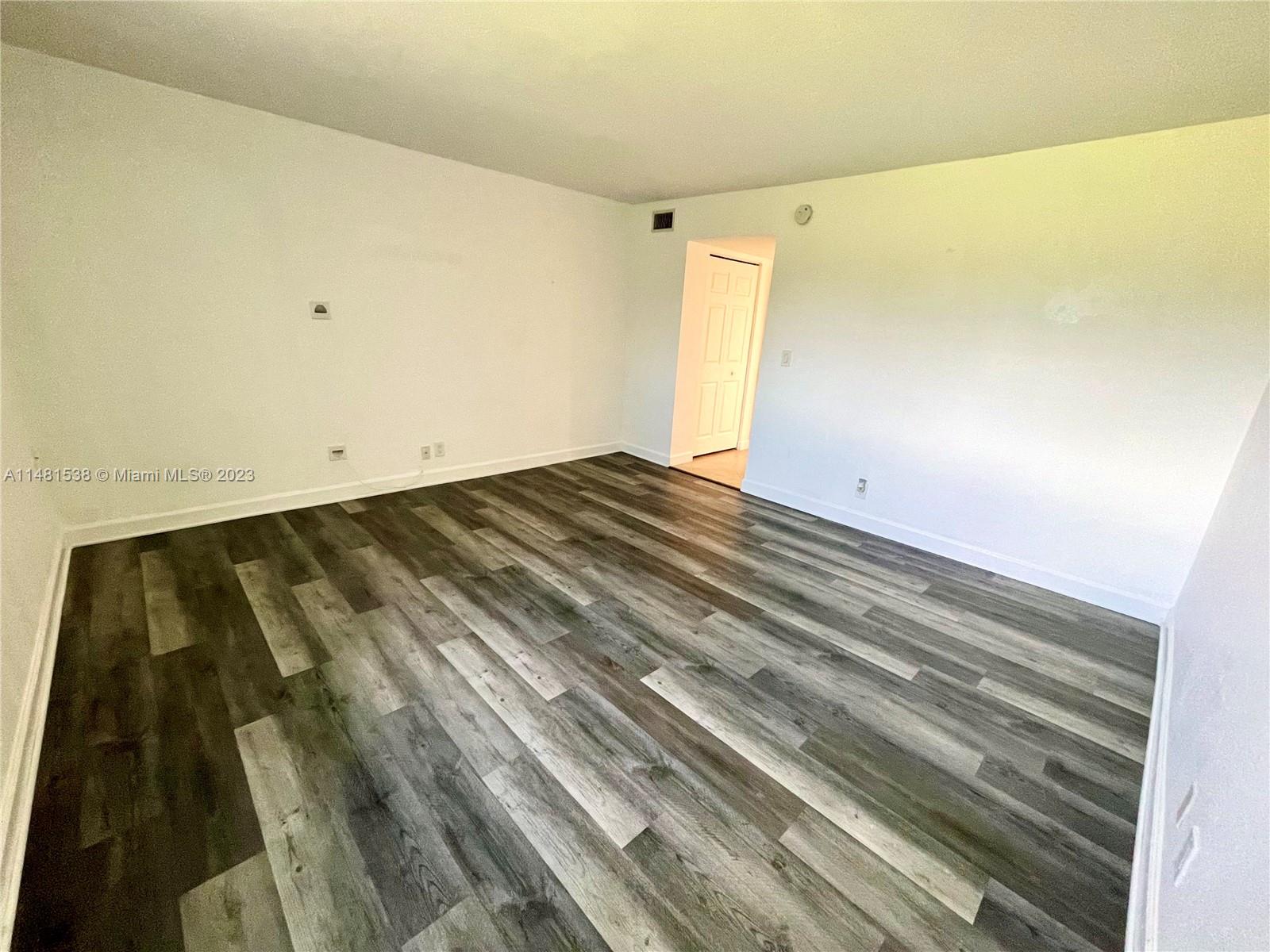 5100 Southwest 90th Avenue, Unit 303 Cooper City, FL 33328 - Photo 36 of 36 a view of wooden floor