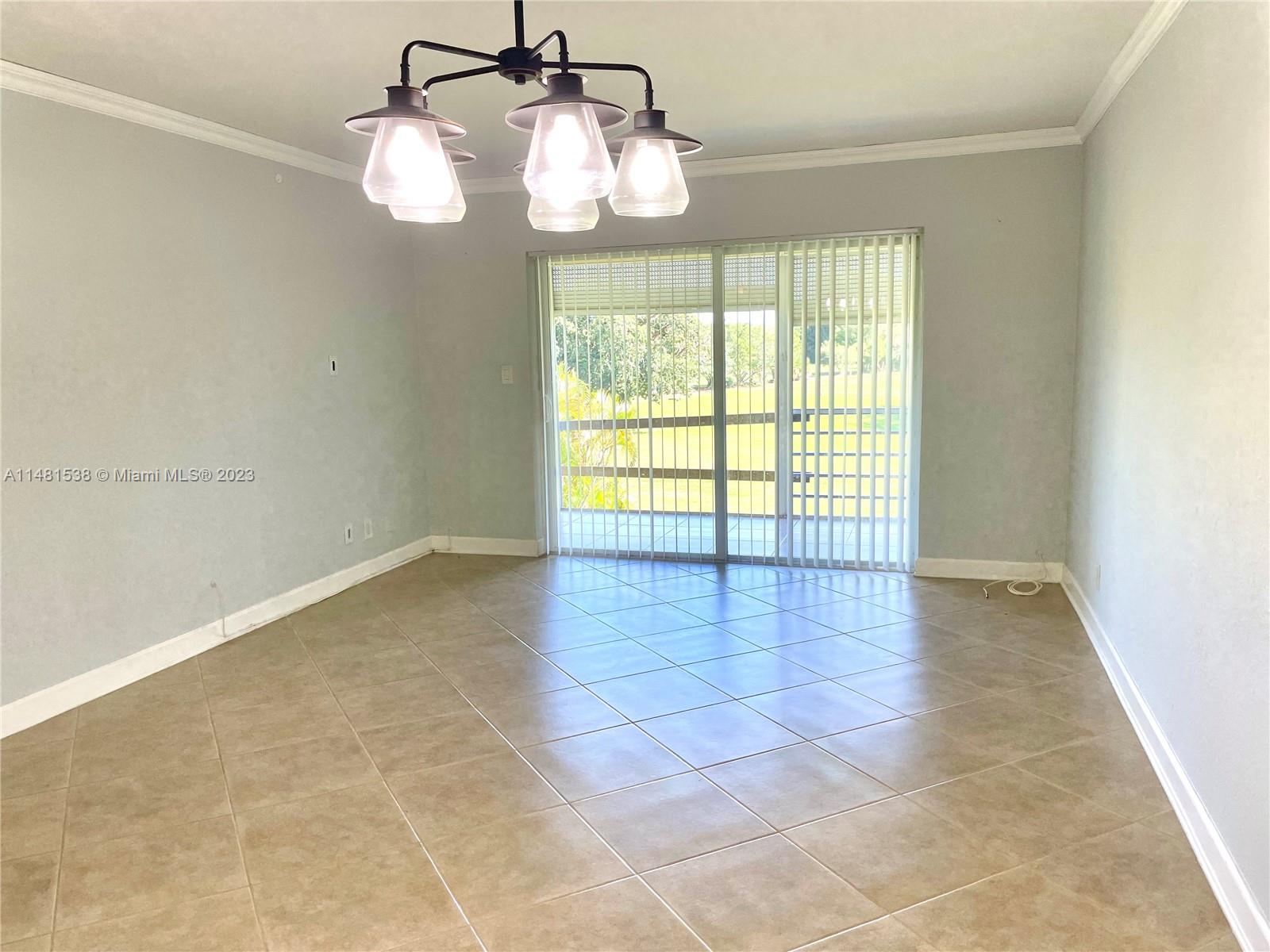 5100 Southwest 90th Avenue, Unit 303 Cooper City, FL 33328 - Photo 5 of 36 a view of an empty room with a window