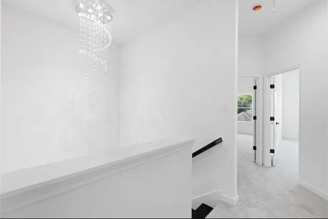 a view of a kitchen with a refrigerator and a cabinets