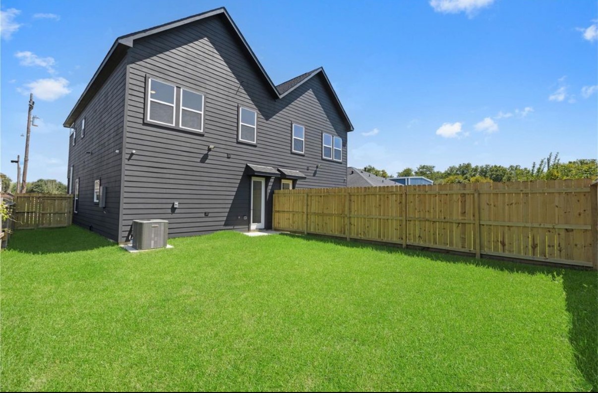 8414 Cannon Street, Unit B Houston, TX 77051 - Photo 7 of 7 a view of a backyard with plants and a garden