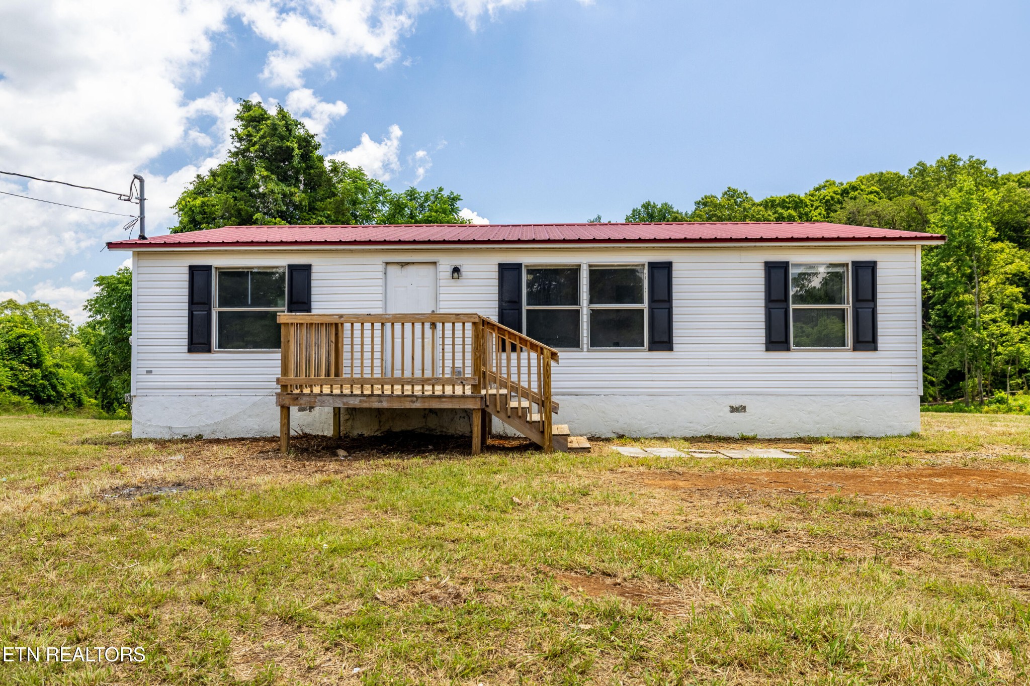 1768 Fain Cemetery Road Dandridge, TN 37725 - Photo 1 of 45 a view of a house with garden and deck