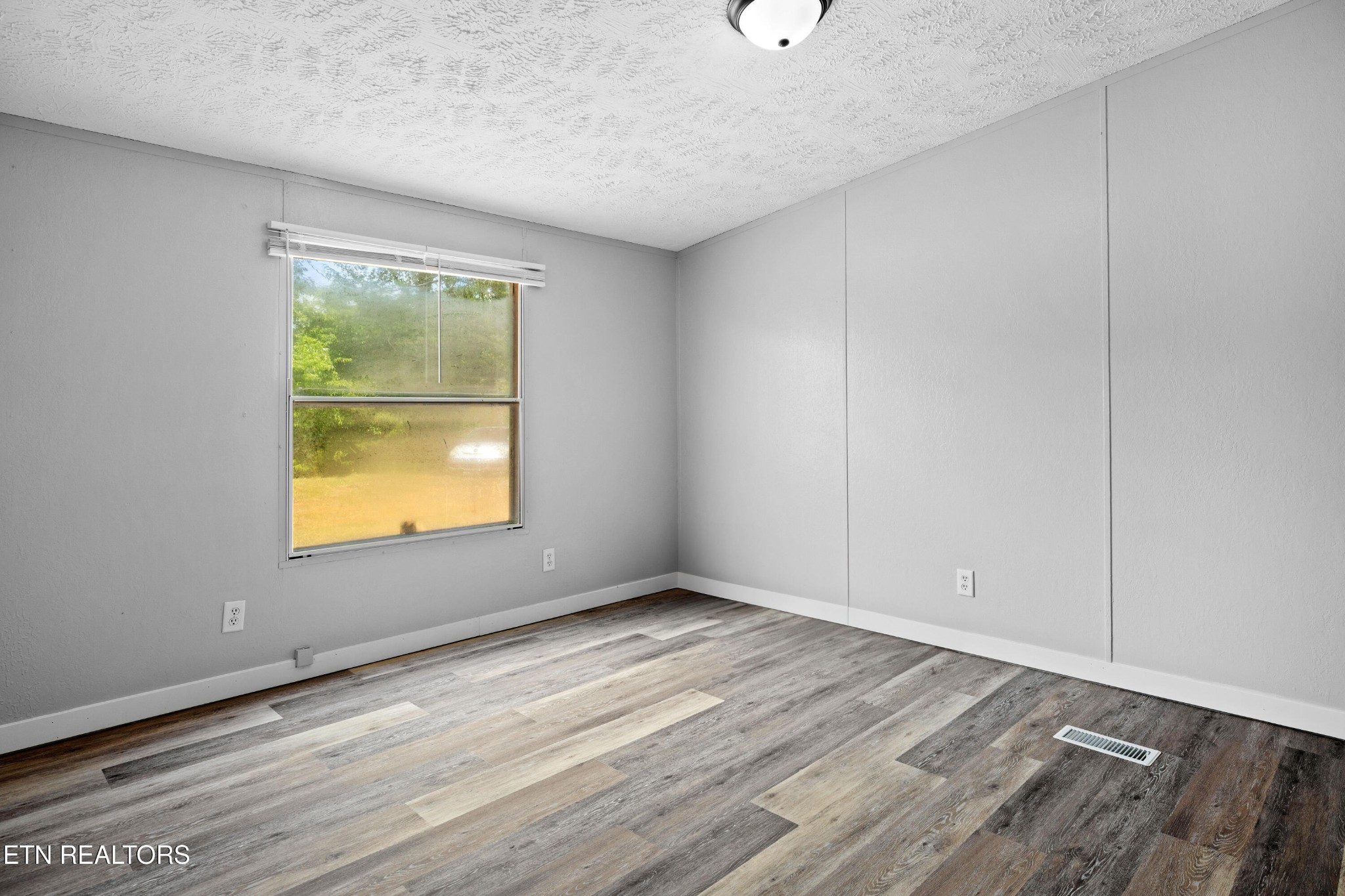 1768 Fain Cemetery Road Dandridge, TN 37725 - Photo 14 of 45 an empty room with a window