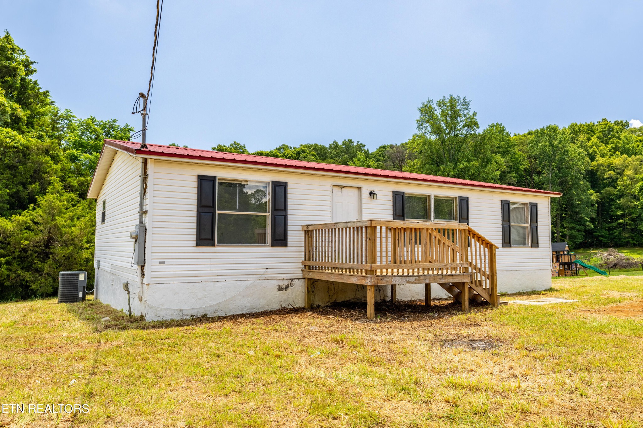 1768 Fain Cemetery Road Dandridge, TN 37725 - Photo 2 of 45 a house view with swimming pool and porch