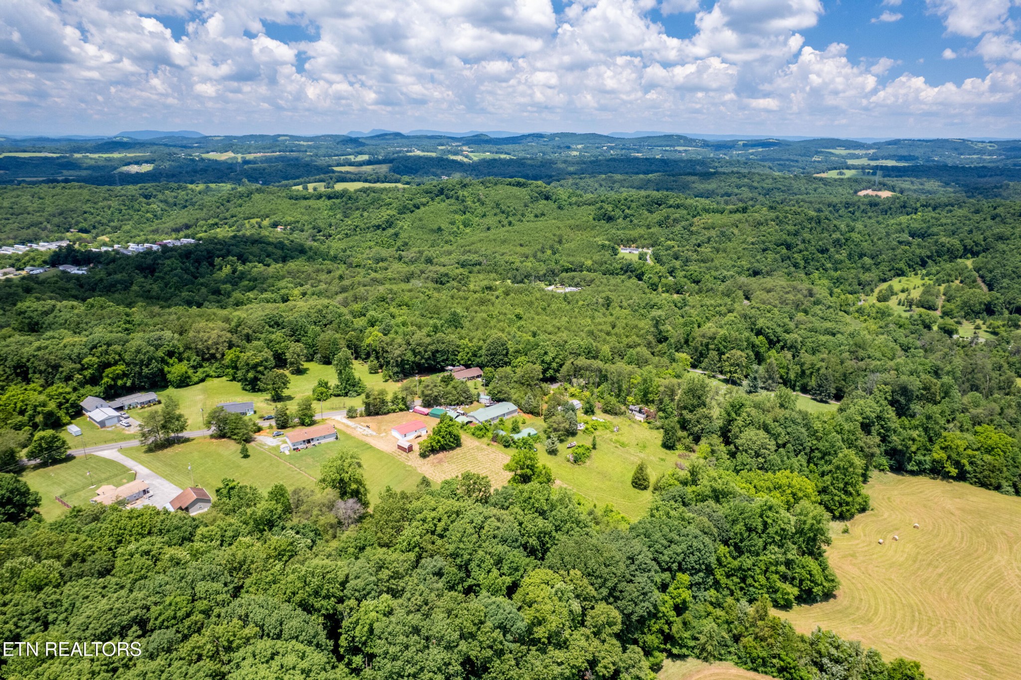 1768 Fain Cemetery Road Dandridge, TN 37725 - Photo 31 of 45 a view of a city with lush green forest