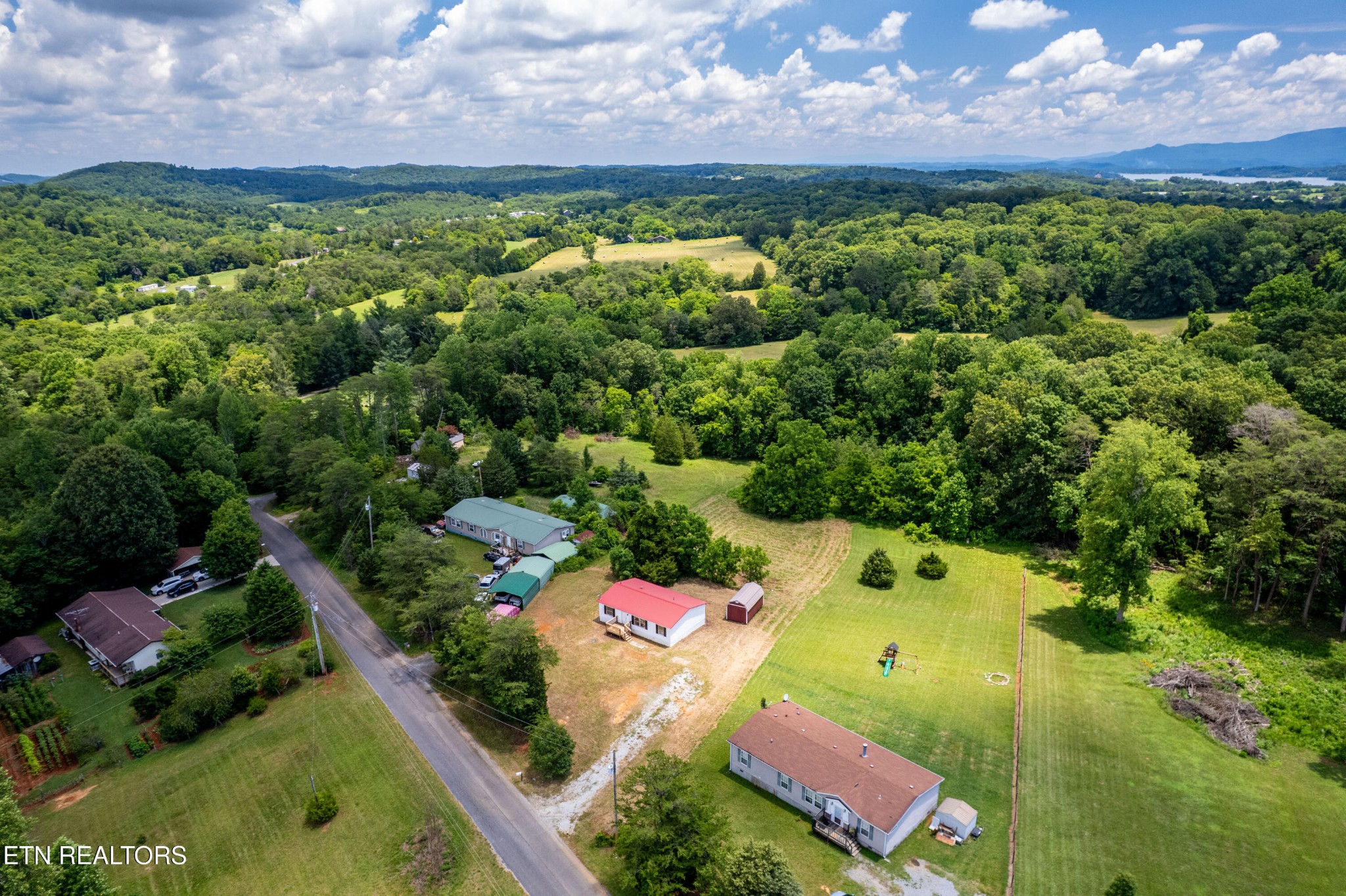 1768 Fain Cemetery Road Dandridge, TN 37725 - Photo 35 of 45 an aerial view of a house with a yard and lake view