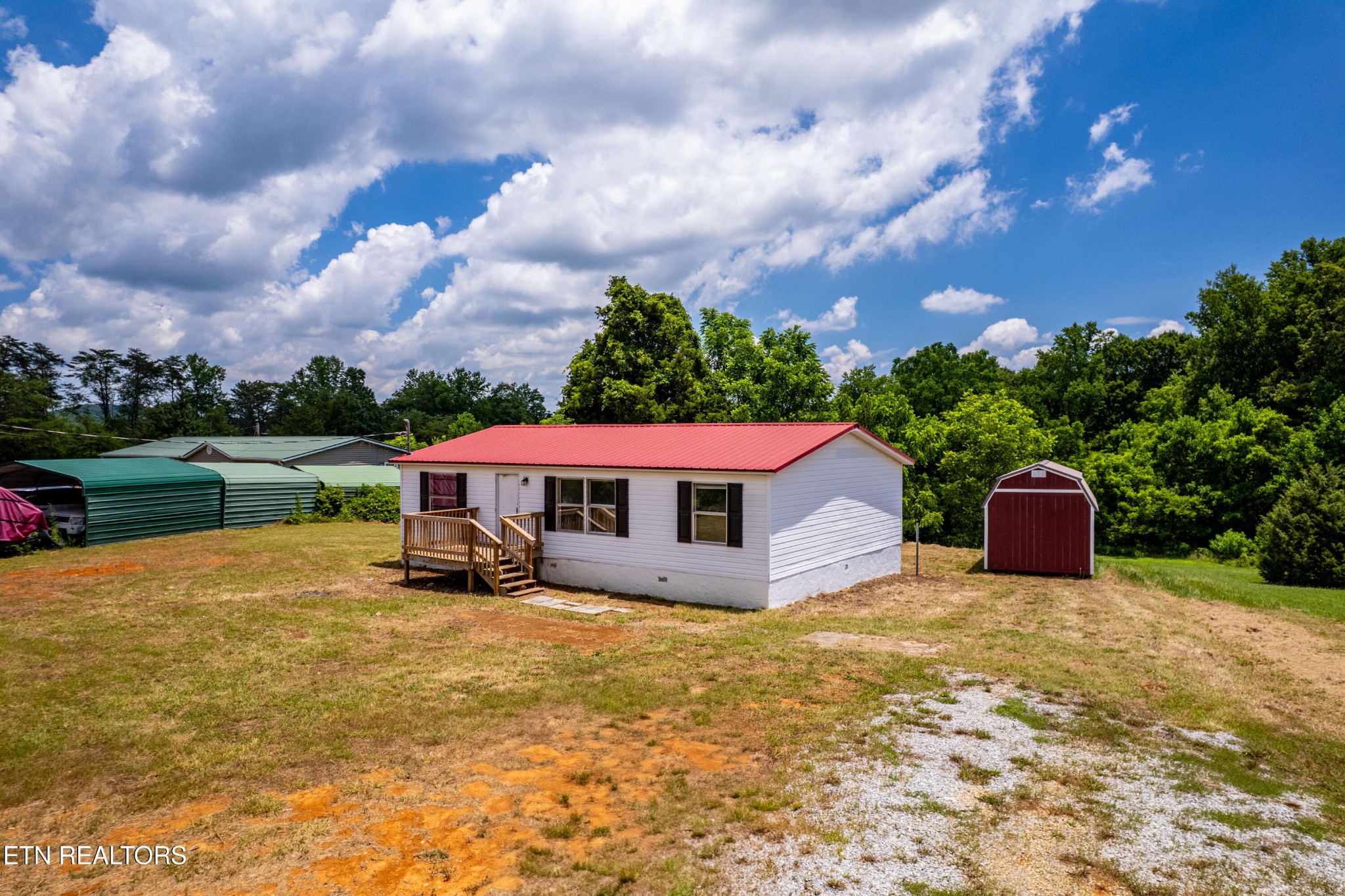 1768 Fain Cemetery Road Dandridge, TN 37725 - Photo 4 of 45 a view of a house with a yard and sitting area