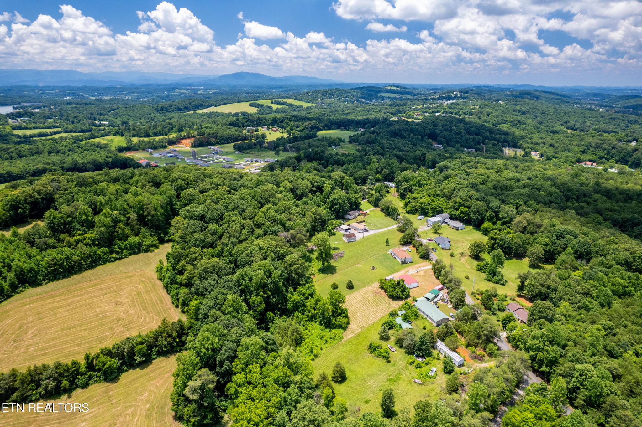 1768 Fain Cemetery Road Dandridge, TN 37725 - Photo 43 of 45 a view of a city with lush green forest