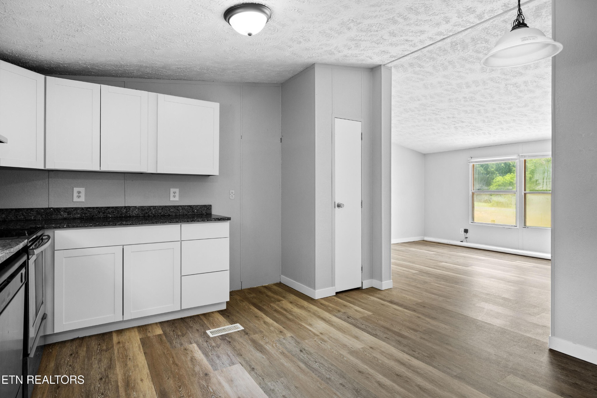 1768 Fain Cemetery Road Dandridge, TN 37725 - Photo 9 of 45 a view of a kitchen with wooden floor