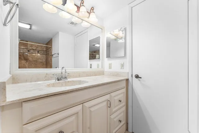 a bedroom with a bed and a television