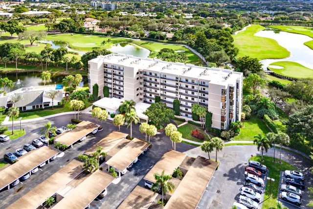 a view of a swimming pool with lounge chairs