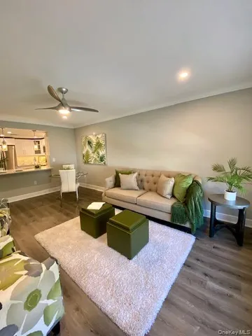 a living room with furniture and view of living room