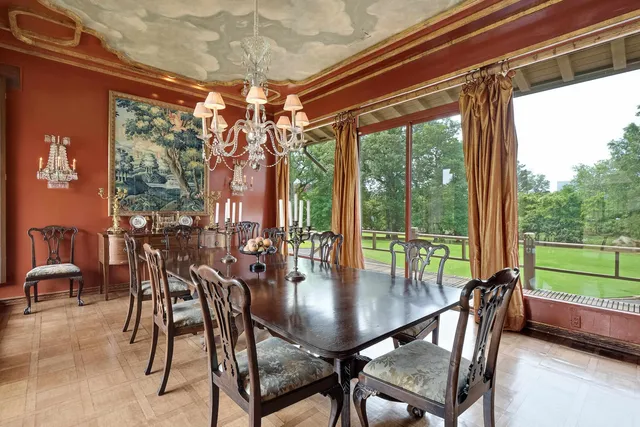 a dining room with furniture and window