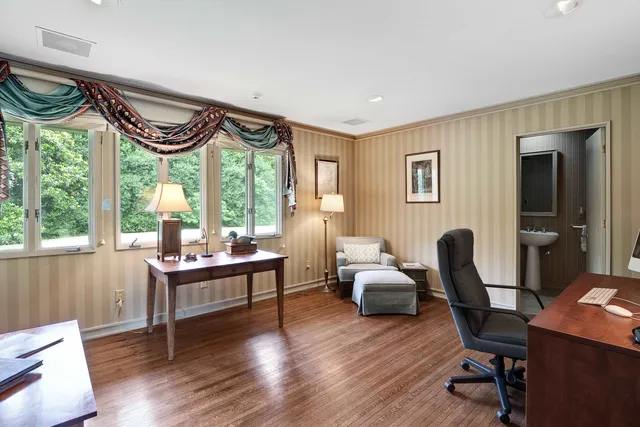 a work room with furniture and a window