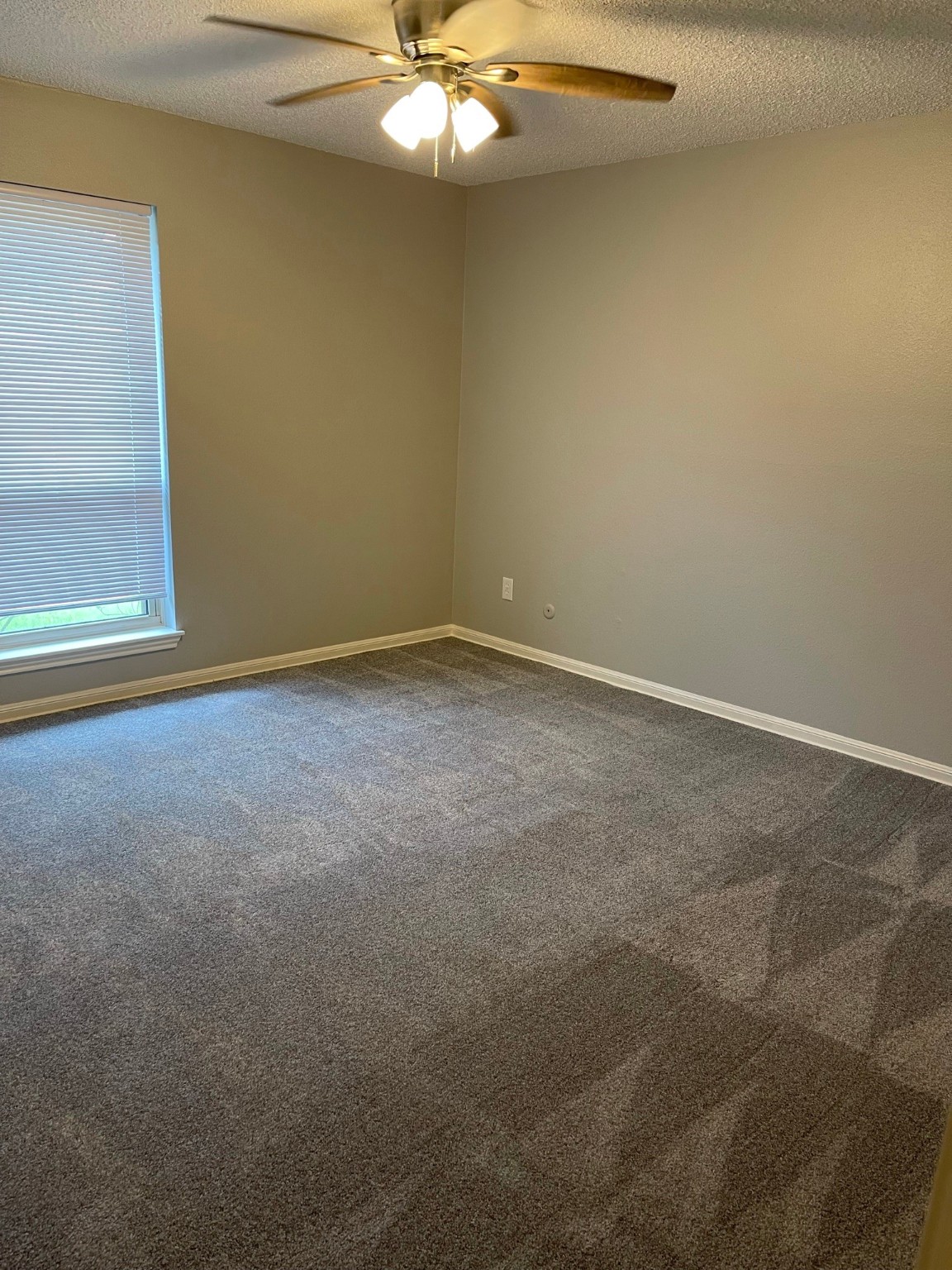 5003 Spring Forest Drive Houston, TX 77091 - Photo 20 of 37 an empty room with a chandelier fan
