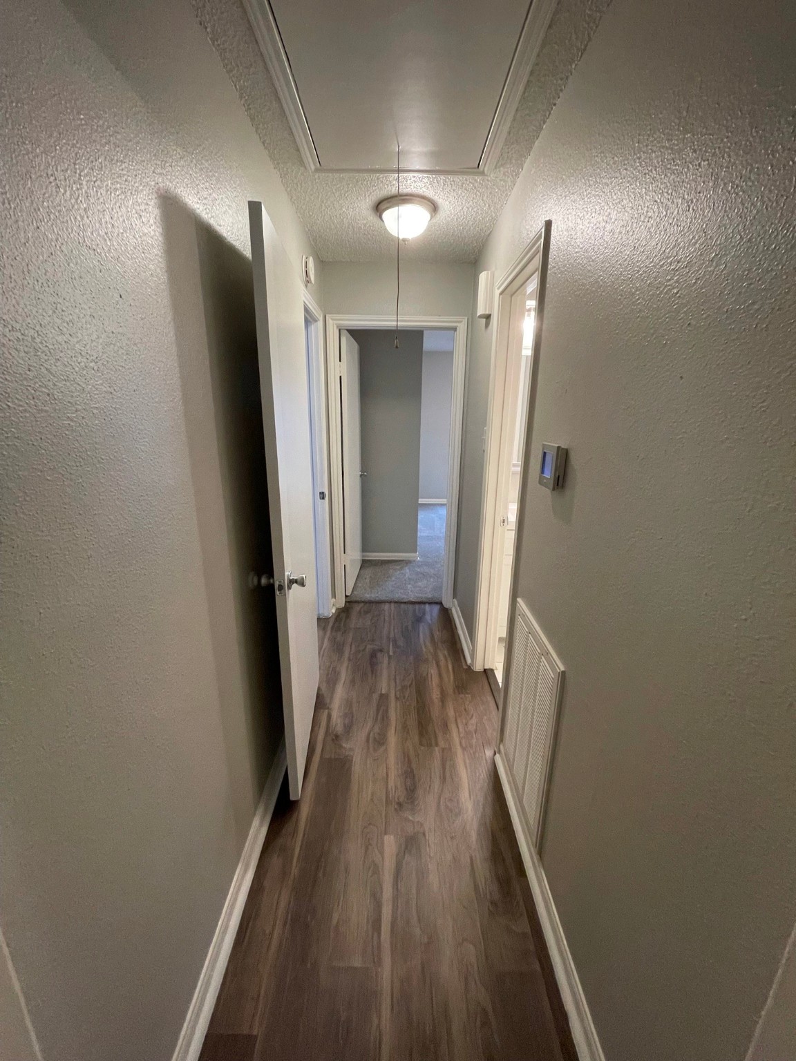 5003 Spring Forest Drive Houston, TX 77091 - Photo 2 of 37 a view of a hallway with wooden floor and staircase