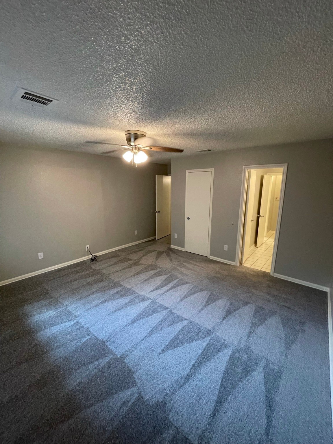 5003 Spring Forest Drive Houston, TX 77091 - Photo 25 of 37 an empty room with wooden floor and windows