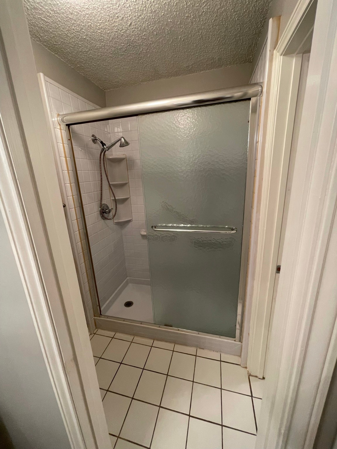 5003 Spring Forest Drive Houston, TX 77091 - Photo 4 of 37 a bathroom with a glass shower door