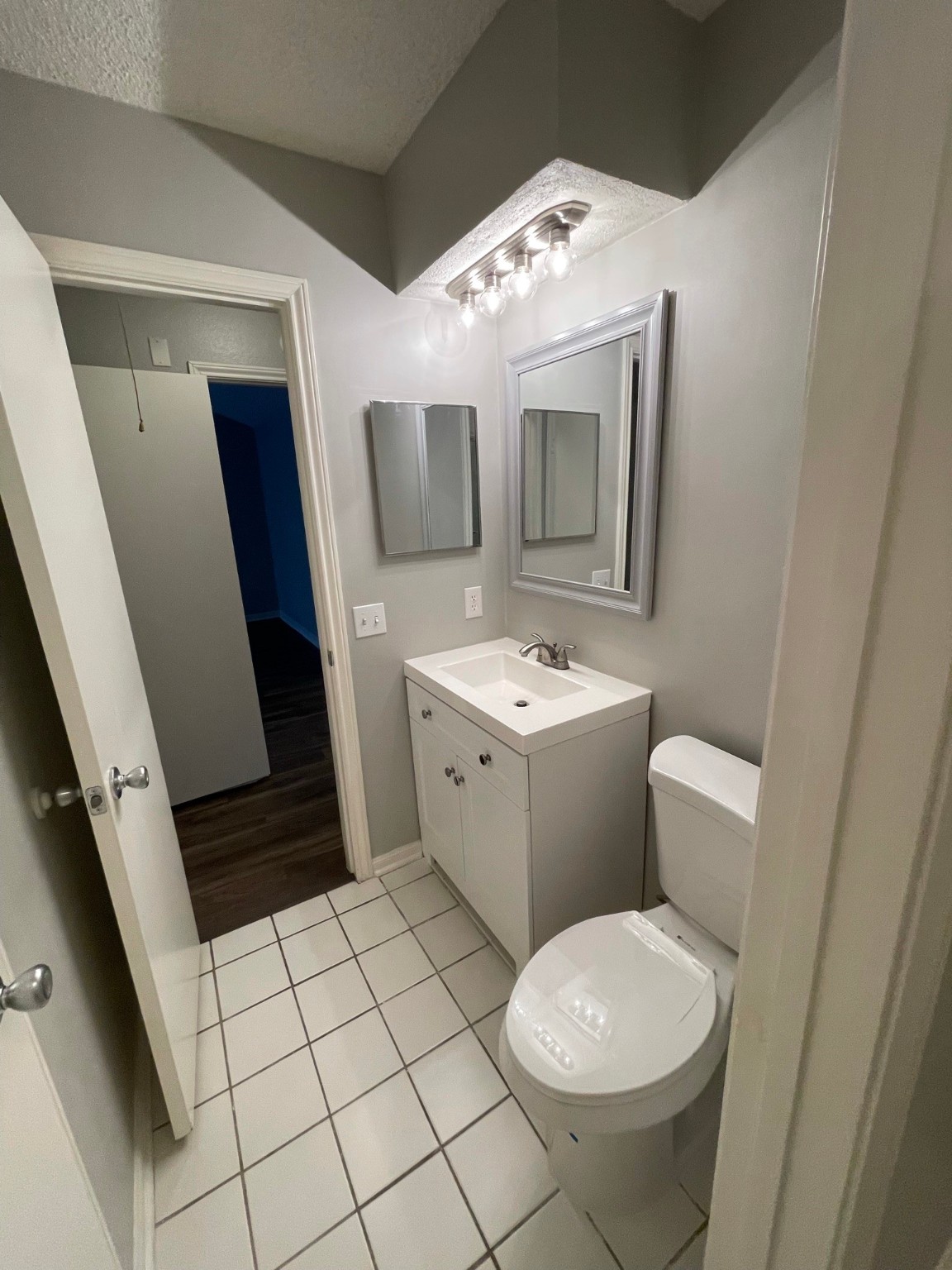 5003 Spring Forest Drive Houston, TX 77091 - Photo 5 of 37 a bathroom with a sink toilet and mirror