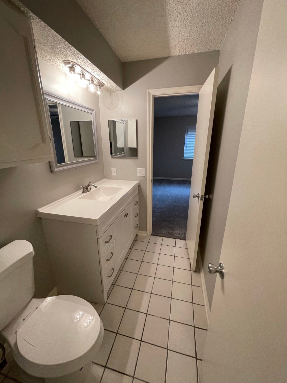 5003 Spring Forest Drive Houston, TX 77091 - Photo 7 of 37 a bathroom with a toilet sink and mirror