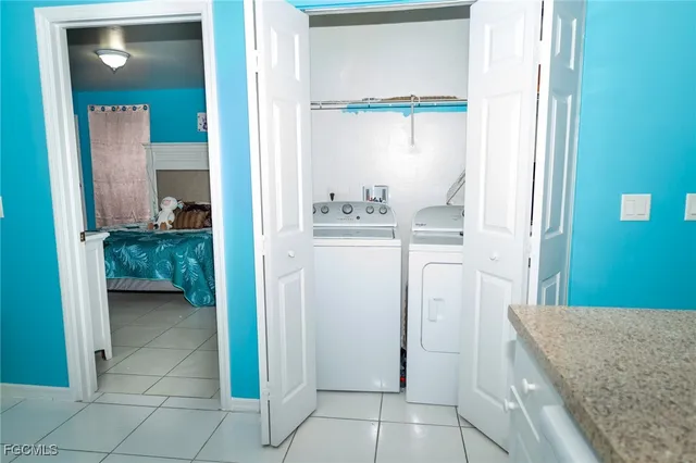 a kitchen with a refrigerator and a sink