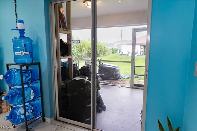 a room with water heater and a floor to ceiling window