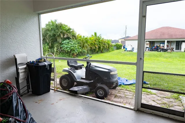 a view of swimming pool with outdoor seating and a garden