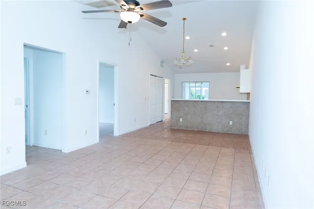 an empty room with a empty space and windows