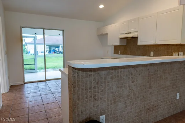 a bathroom with a sink a mirror and a shower