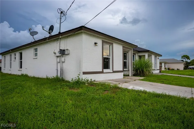 a front view of a house with garden
