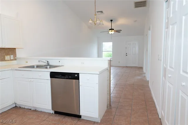 a bathroom with a granite countertop toilet a sink and bathtub