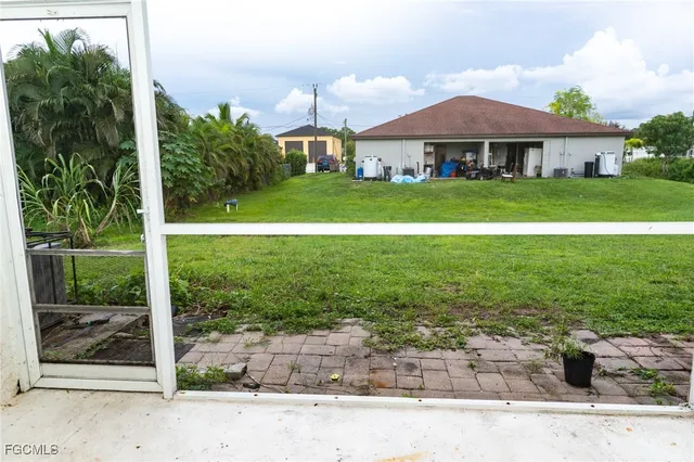 an aerial view of residential houses with outdoor space and street view