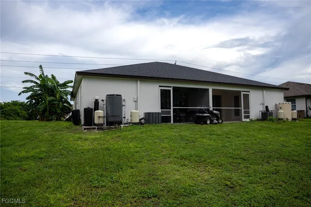 a view of a backyard with plants and a garden