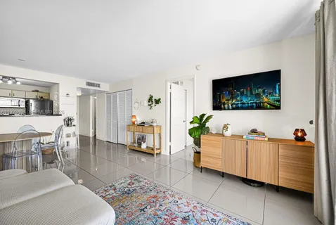 a kitchen with stainless steel appliances white cabinets and a sink