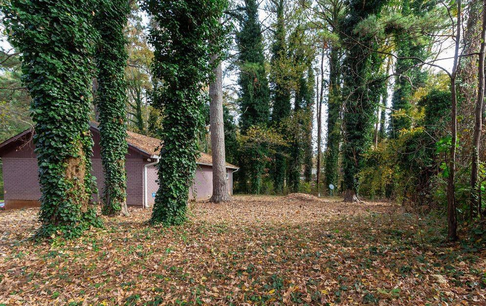 687 Utoy Court Jonesboro, GA 30238 - Photo 2 of 3 a street view with large trees