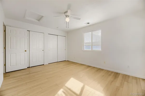 a view of an empty room with glass door