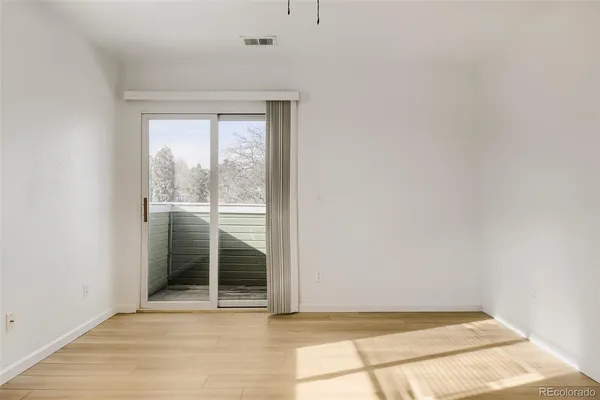 a view of a two chairs in a balcony
