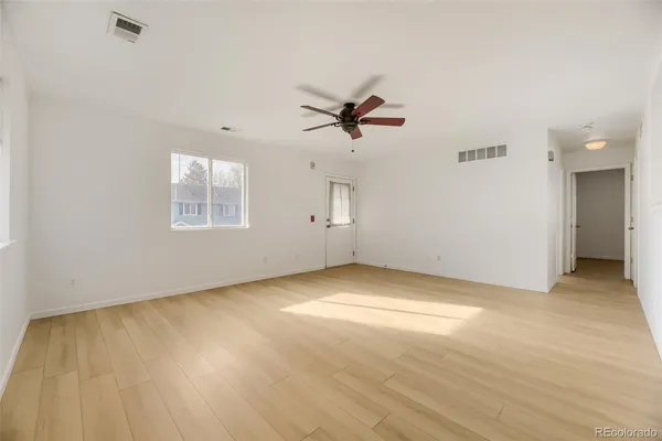 a view of an empty room with a window