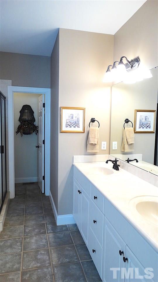 10335 Evergreen Spring Place Raleigh, NC 27614 - Photo 11 of 25 Tiled Floors, Whirlpool Tub, Separate Custom-Tiled Shower, (2) Walk-in Closets, Double Vanity.