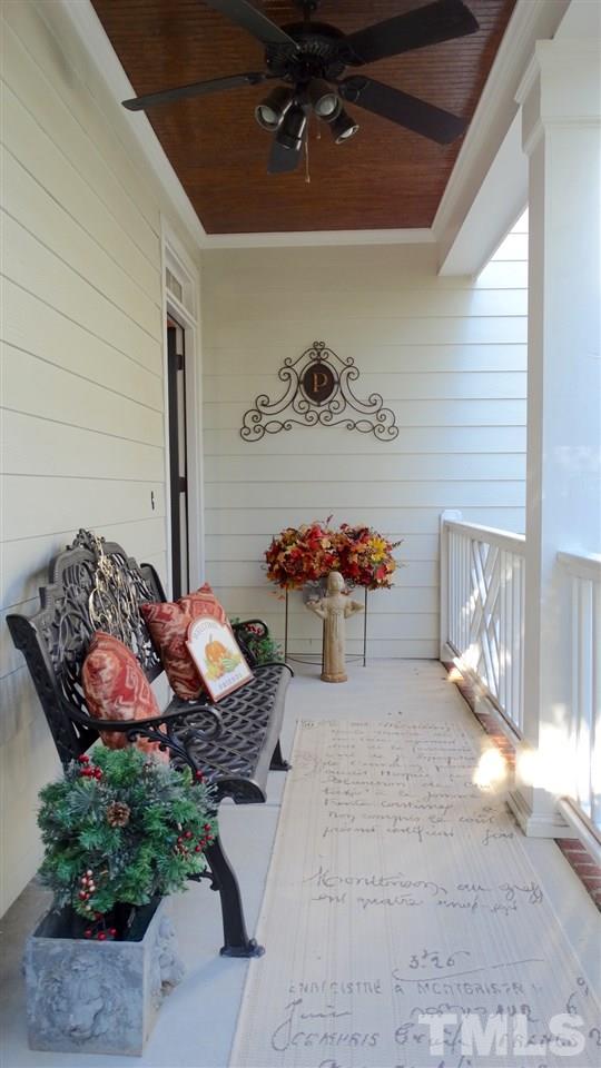 10335 Evergreen Spring Place Raleigh, NC 27614 - Photo 20 of 25 The Charming Charleston Front Sleeping Porch on the Main Floor is a welcoming touch to your guests as they enter the home.