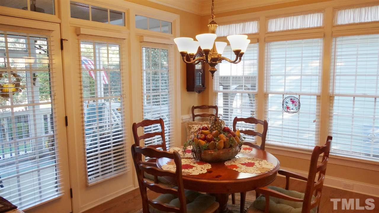 10335 Evergreen Spring Place Raleigh, NC 27614 - Photo 7 of 25 Bright, Airy with so many windows! Beautiful Breakfast Room open to Kitchen & Family Rooms, leads out to Screened Porch. Imagine having your coffee at this table in the morning, looking out to the porch and yard beyond. Pure Bliss!
