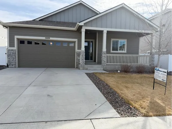 a front view of a house with garage