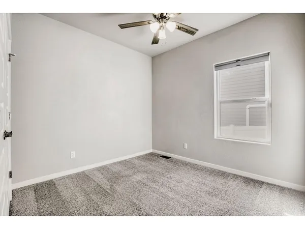 a bathroom with a sink toilet vanity and shower