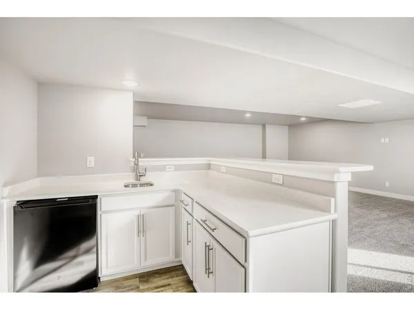 a kitchen with a sink and cabinets