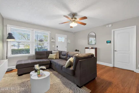 a living room with furniture and a large window